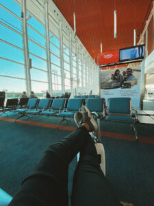 person sitting alone in an airport terminal