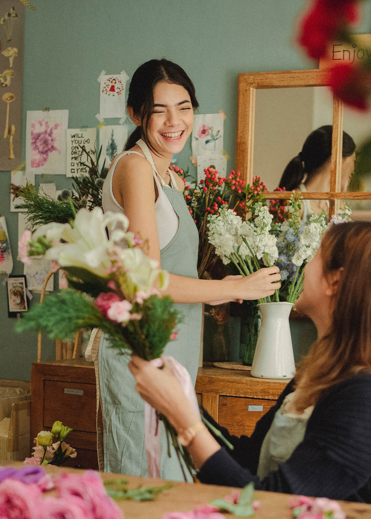 small business owner holding flowers