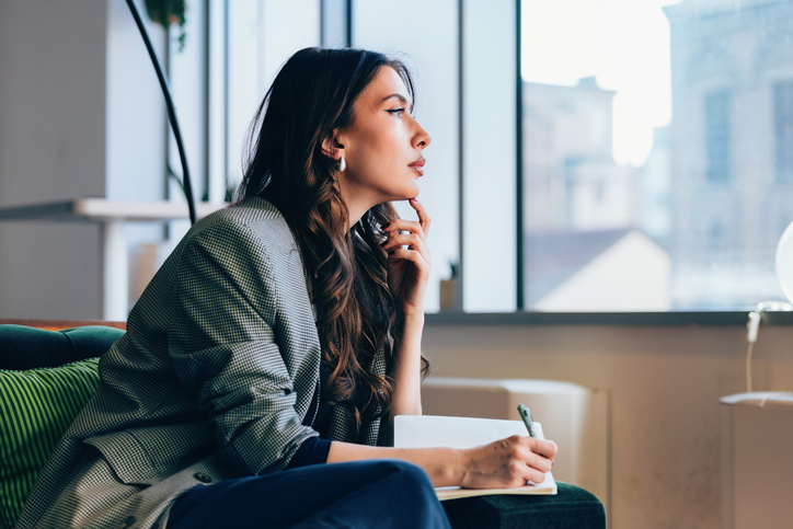 Woman thinking about owning a franchise. Best franchise under $10,000