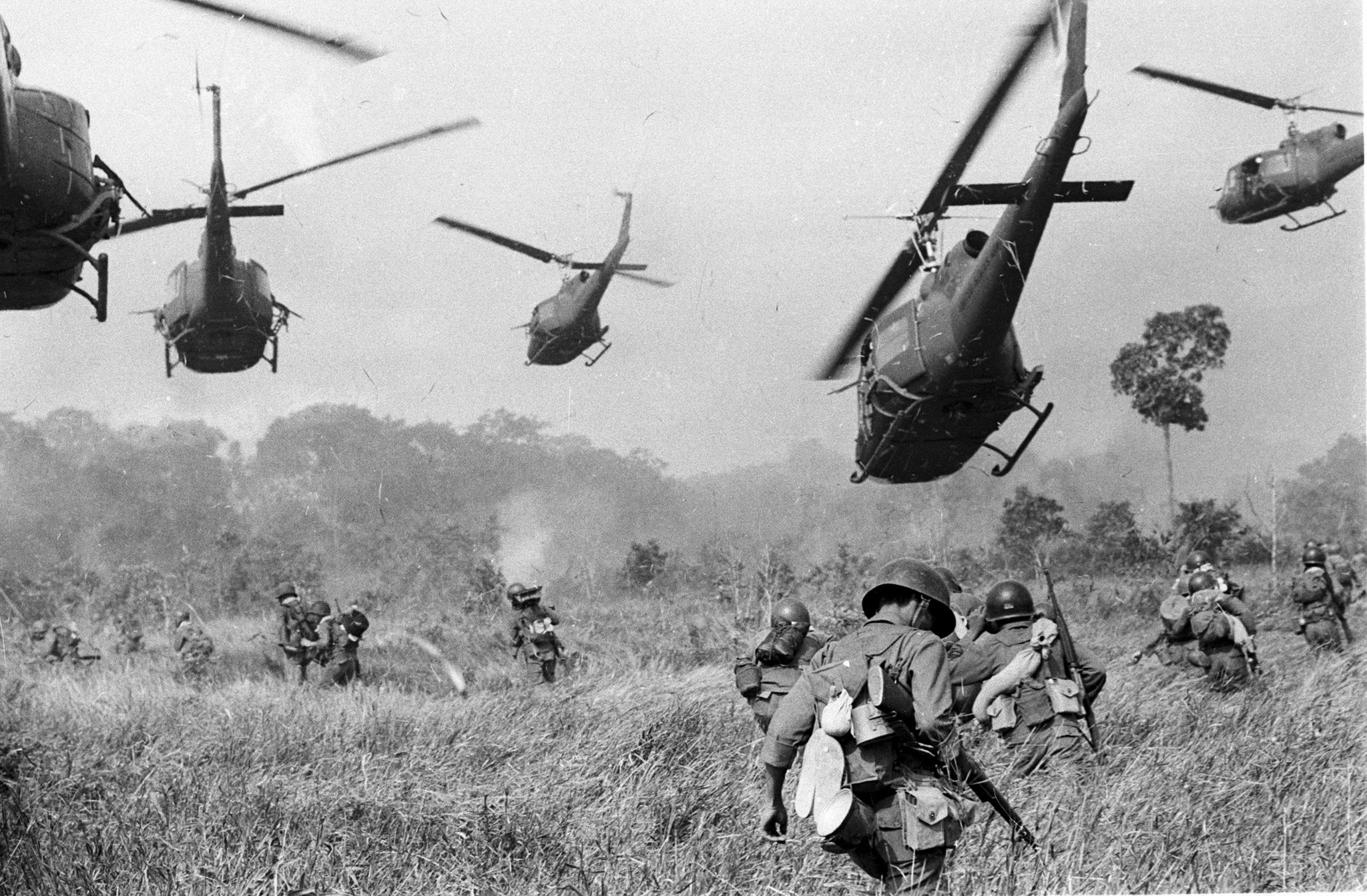 Vietnam War scene with helicopters in the rice fields.